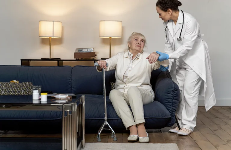 A doctor helping a senior woman walk
